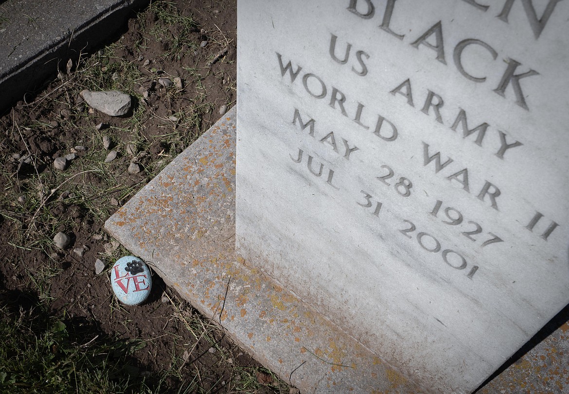 A rock is placed in loving memory. (Tracy Scott/Valley Press)