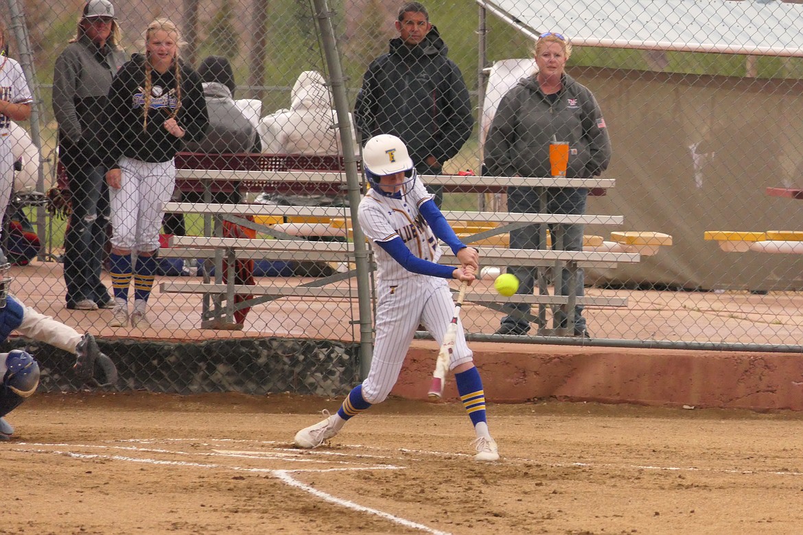 Thompson Falls ophomore Teagan Saner connects with a first inning pitch during the Lady Hawks State Class B championship tournament this past Thursday in rainy Anaconda. against Shepherd. (Chuck Bandel/VP-MI)