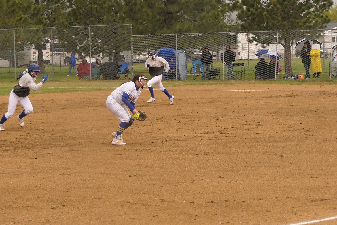 Junior shortstop Olivia Harnett prepares to throw out a Shepherd batter after scooping up a ground ball during the first inning of the Lady Hawks State tournament game vs Shepherd Thursday in Anaconda. (Chuck Bandel/VP-MI)