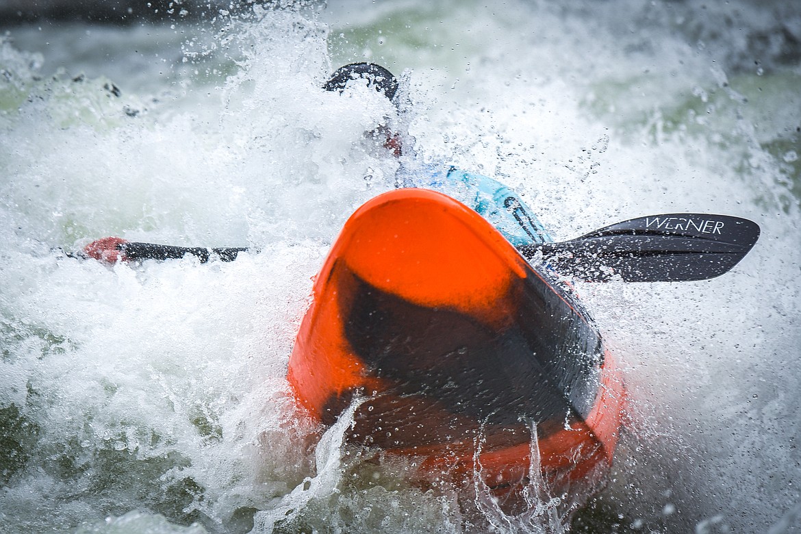 A kayaker navigates a section of the Wild Mile along the Swan River during the Expert Slalom event at the 48th annual Bigfork Whitewater Festival on Saturday, May 27. (Casey Kreider/Daily Inter Lake)