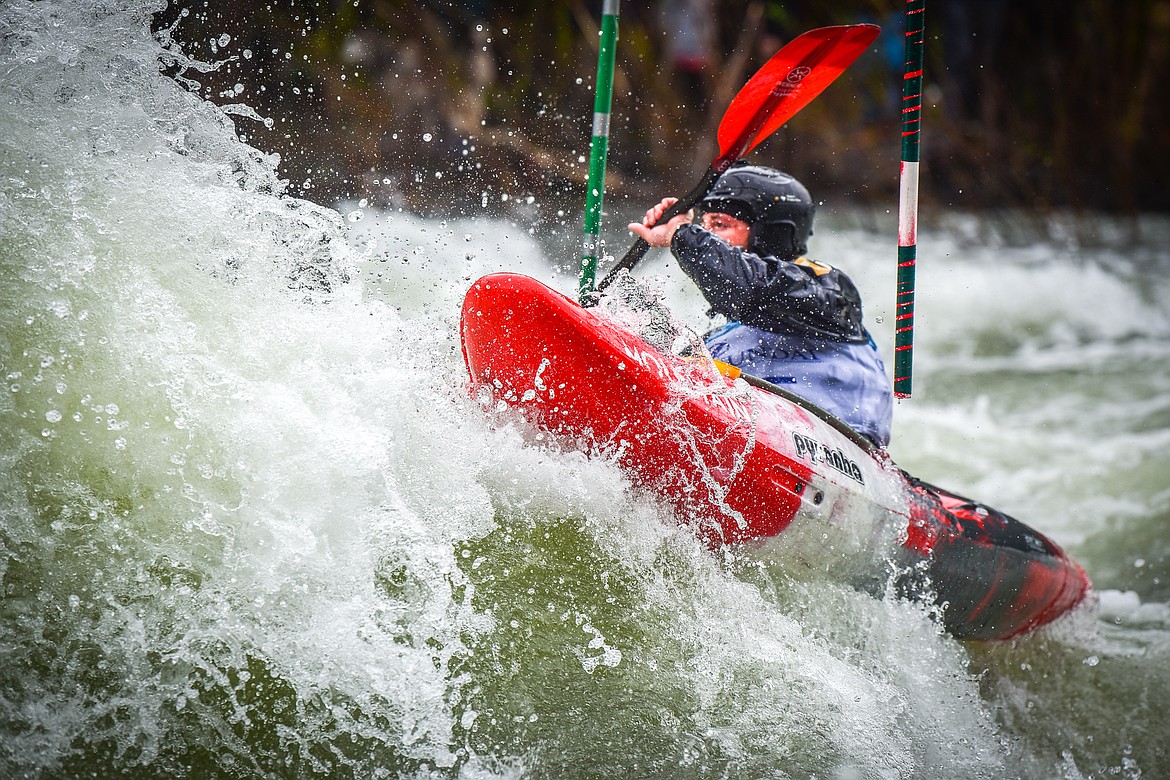 A kayaker navigates a section of the Wild Mile along the Swan River during the Expert Slalom event at the 48th annual Bigfork Whitewater Festival on Saturday, May 27. (Casey Kreider/Daily Inter Lake)