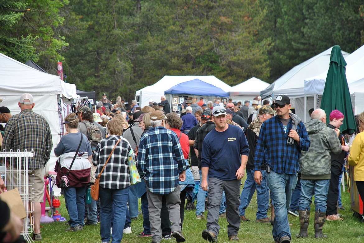 At 9 a.m. Saturday morning, Mullan Gulch Road in St. Regis was empty and quiet under overcast skies. But by 10 a.m., as the fog dissipated, the sleepy town of St. Regis was bustling with visitors, and parking was bursting at the seams. The 46th Annual Memorial Day Flea Market at the St. Regis Park was officially underway and every dog-walking, wagon-pulling, bargain-hunting person was there to see it. (Amy Quinlivan/Mineral Independent)