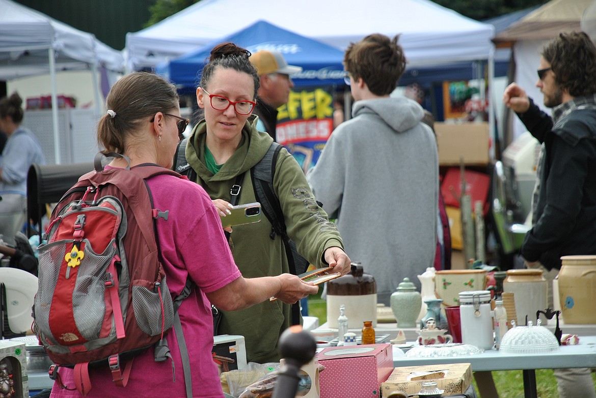 Part of the lure of Flea Market weekend in St. Regis is the opportunity to socialize with the sellers and fellow buyers. (Amy Quinlivan/Mineral Independent)