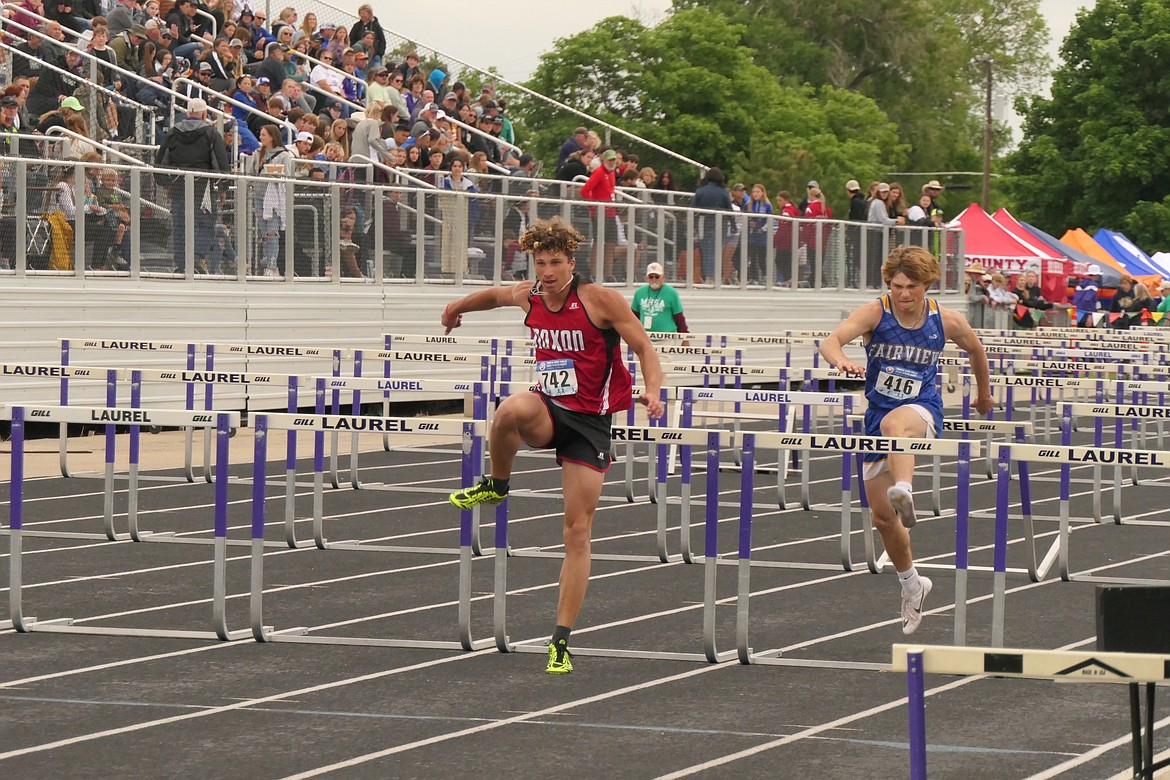 Noxon sophomore Ricky Williams clears a hurdle during a heat in the men's Class C hurdles event during competition Friday morning in Laurel. (Chuck Bandel/MI-VP)