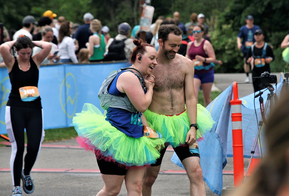 Jessica Canfield and Nathan Hope smile after finish the 5K at McEuen Park on Sunday.