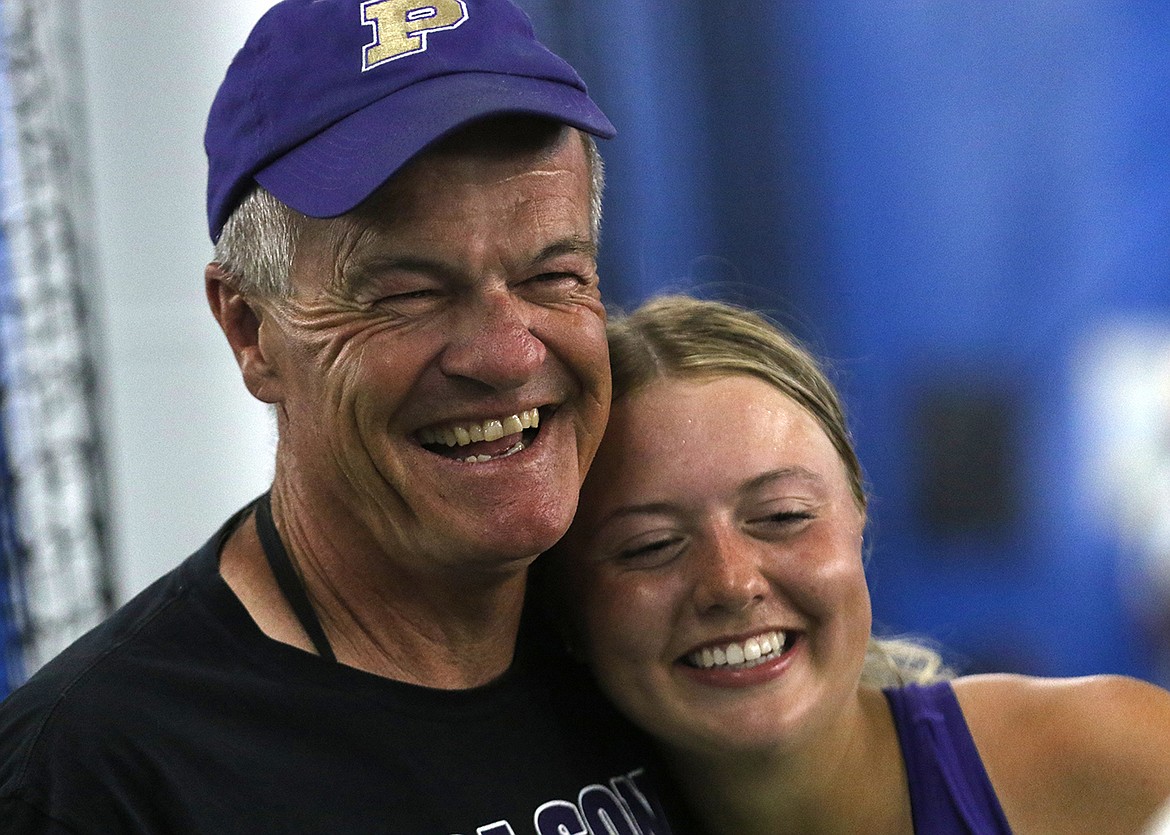 Polson Coach Bob Hislop hugs newly crowned State A Girls Tennis Champ Clara Todd. (Bob Gunderson photo)