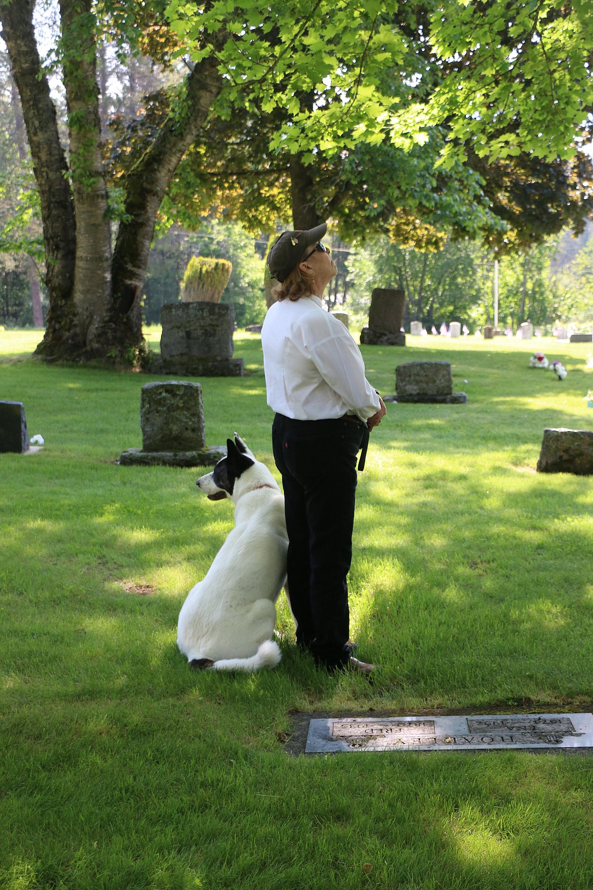 Veteran Julie Washburn listens to the Memorial Day ceremony at Pinecrest Cemetery on Monday.