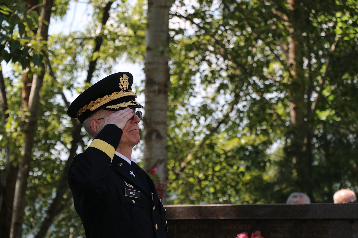 Bryan Hult, a retired U.S. Army brigadier general and Bonner County Veterans Services officer, salutes as "Taps" is played during Monday's Memorial Day ceremony at Lakeview Cemetery.