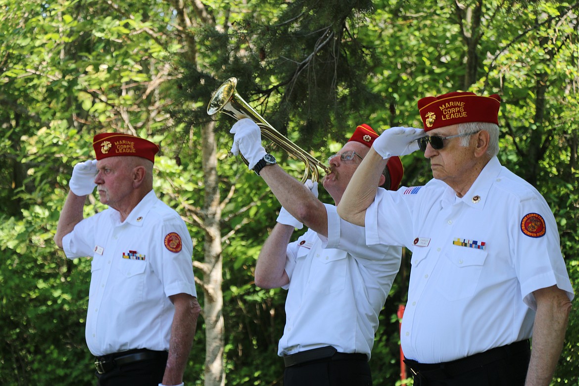 Members of the Marine Corps League honor guard salute as "Taps" is played at Lakeview Cemetery during Monday's Memorial Day tribute.