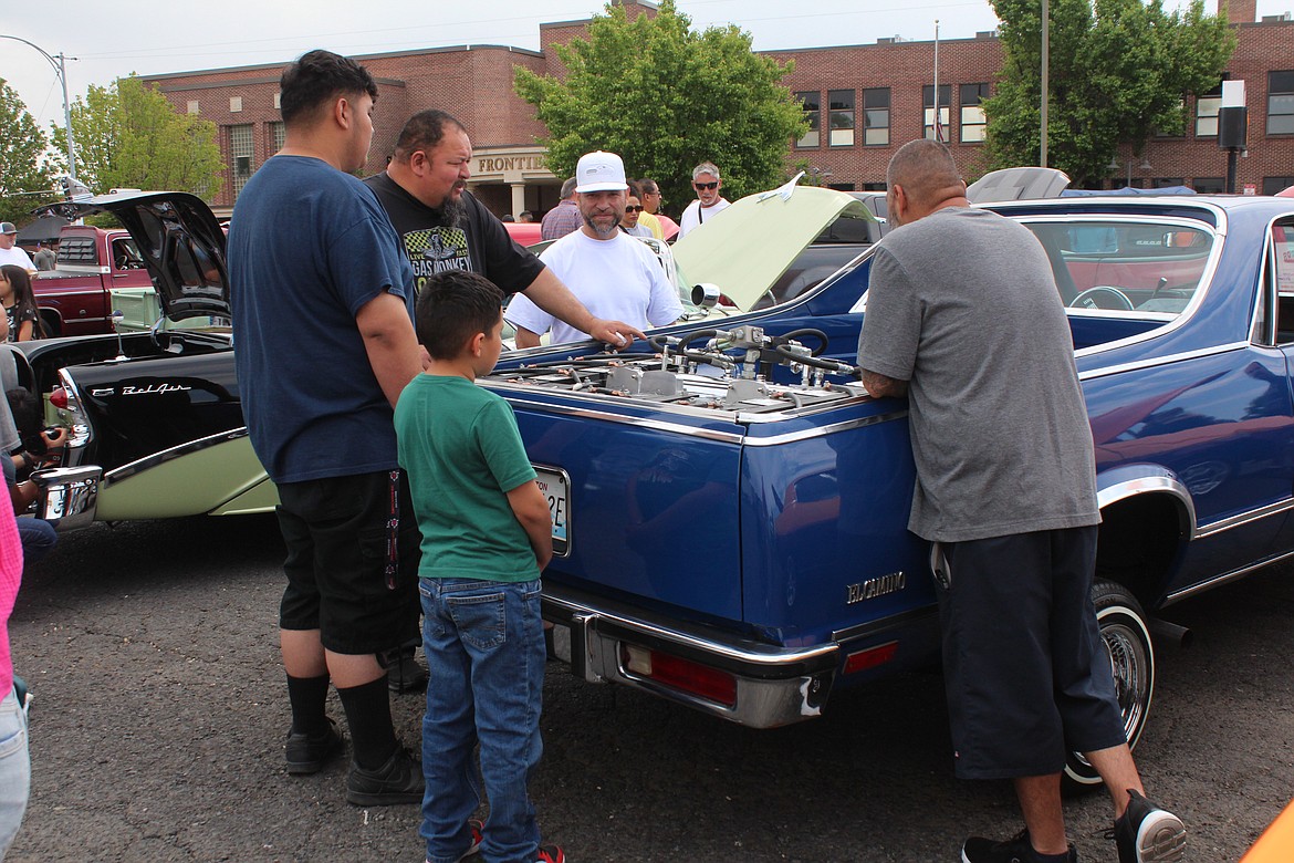 A car owner explains the work he did on his car during the Spring Festival car show.
