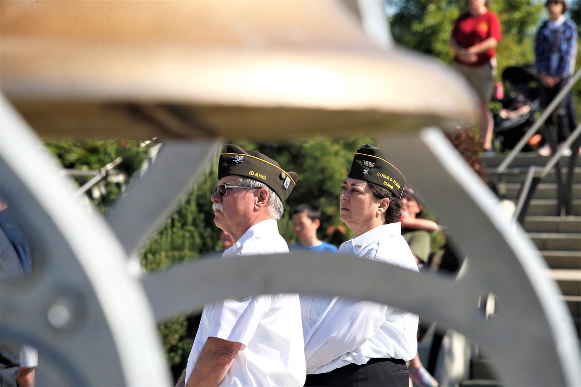 Dennis Watson and Krystal Skinkle listen to a speaker during Monday's Memorial Day event at Veterans Plaza.