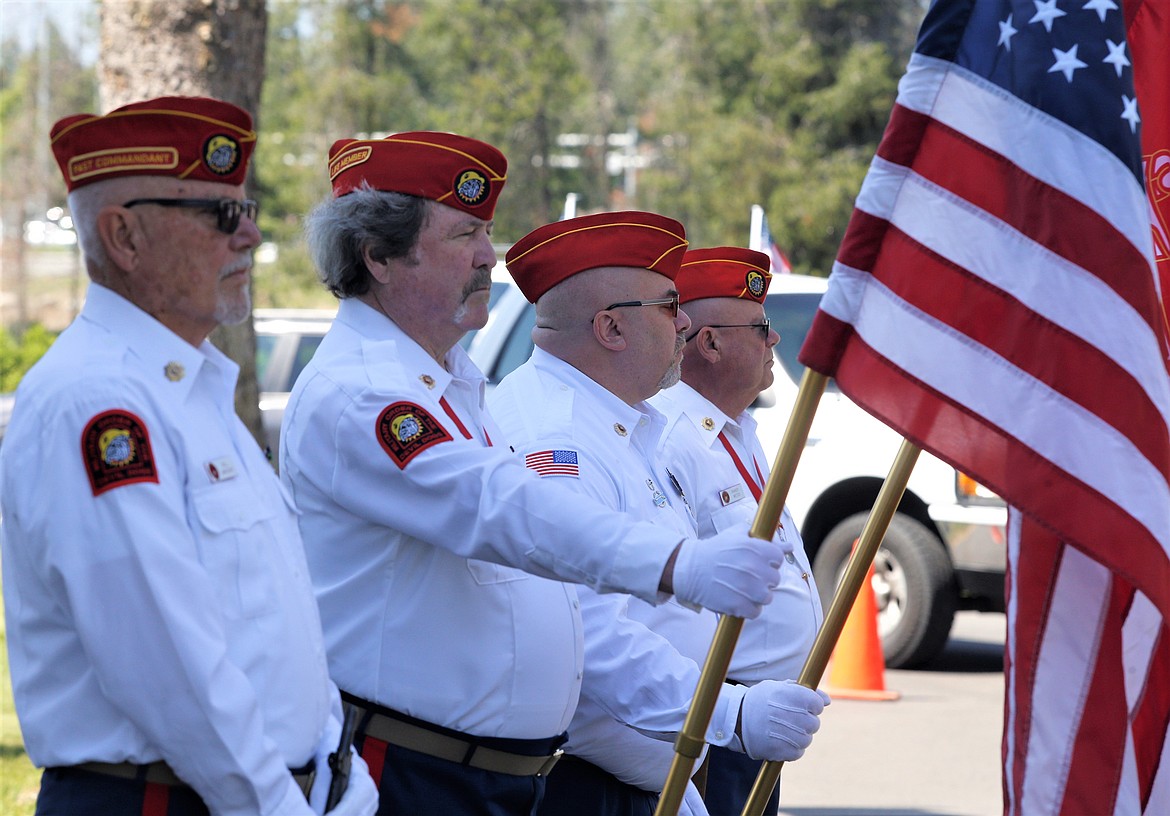 Veterans, from left, Bill Maroney, Dennis Dodd, Chris Spatz and Randy Weiss participate in the Memorial Day ceremony at Coeur d'Alene Memorial Gardens.