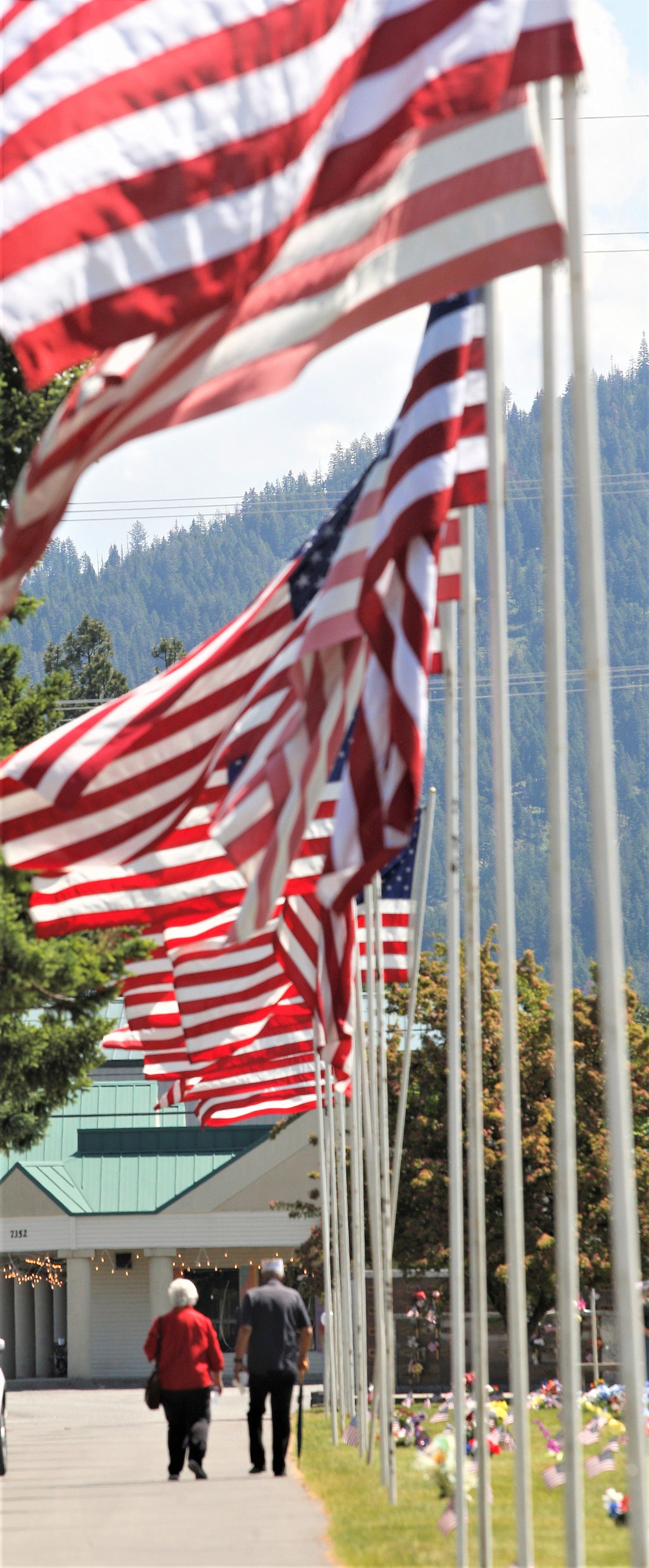 A couple walk away following the Memorial Day ceremony at Coeur d'Alene Memorial Gardens.