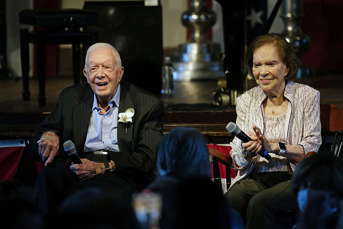 Former President Jimmy Carter and his wife former first lady Rosalynn Carter sit together during a reception to celebrate their 75th wedding anniversary on July 10, 2021, in Plains, Ga. The Carter family shared news that Rosalynn Carter has dementia, The Carter Center announced Tuesday, May 30, 2023. (AP Photo/John Bazemore, Pool, File)