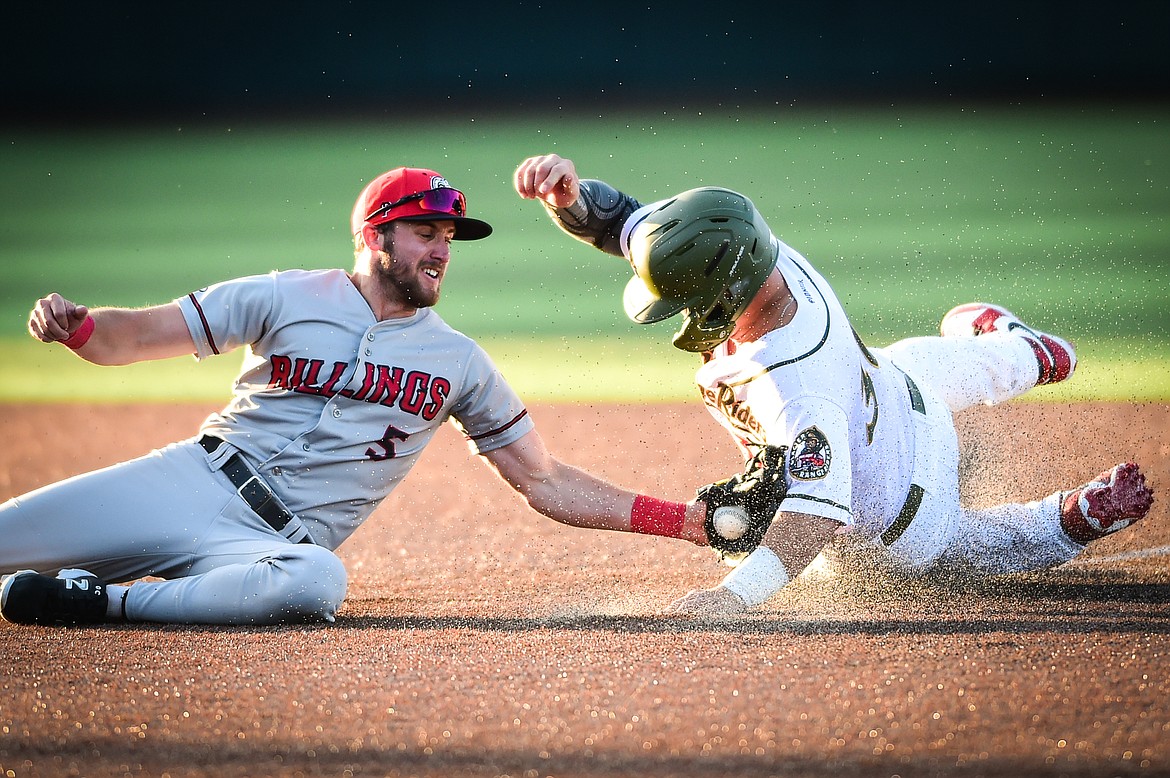 Glacier's Dean Miller (30) is tagged out stealing second by Billings Mustangs shortstop Casey Harford (5) in the third inning at Glacier Bank Park on Tuesday, May 30. (Casey Kreider/Daily Inter Lake)