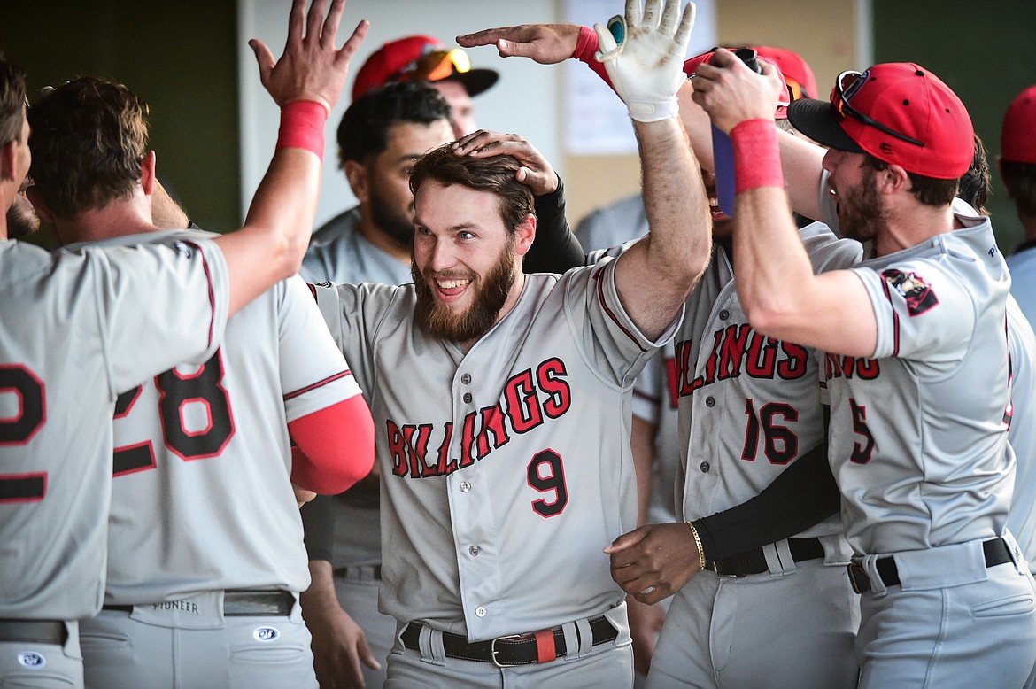 Billings celebrates after back-to-back home runs by Casey Harford and Connor Denning (9) in the third inning against the Glacier Range Riders at Glacier Bank Park on Tuesday, May 30. (Casey Kreider/Daily Inter Lake)