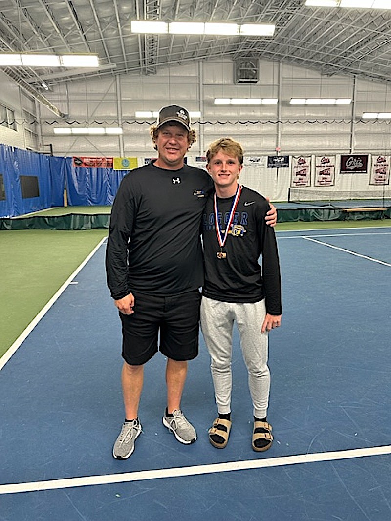 Libby sophomore Ryan Beagle and head coach Kyle Hannah celebrate Beagle's third-place finish at the Class A Montana State Tennis Championships on Saturday, May 27 in Missoula.