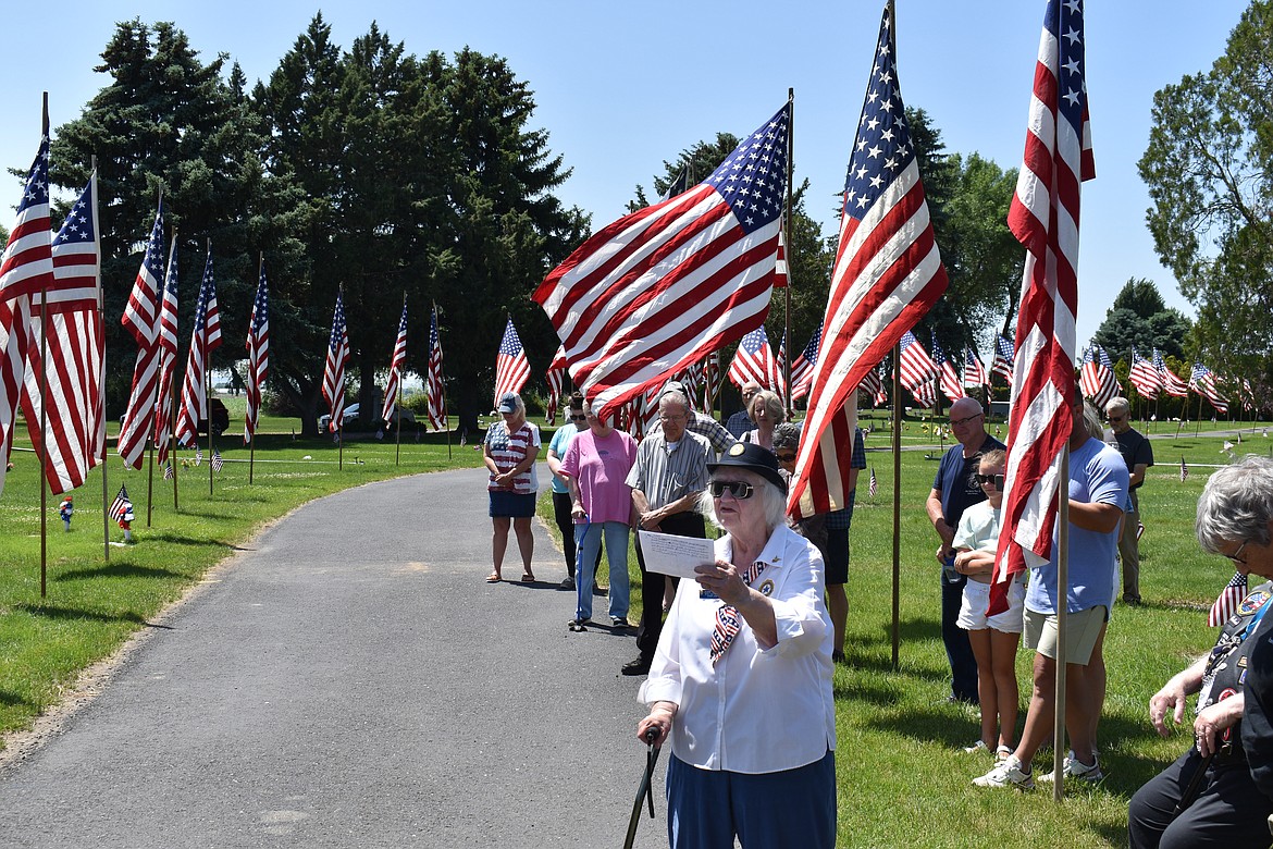 Jeanie Radder, past American Legion Auxiliary Fourth District chaplain, delivers the opening prayer at the Memorial Day ceremony at Pioneer Memorial Gardens.