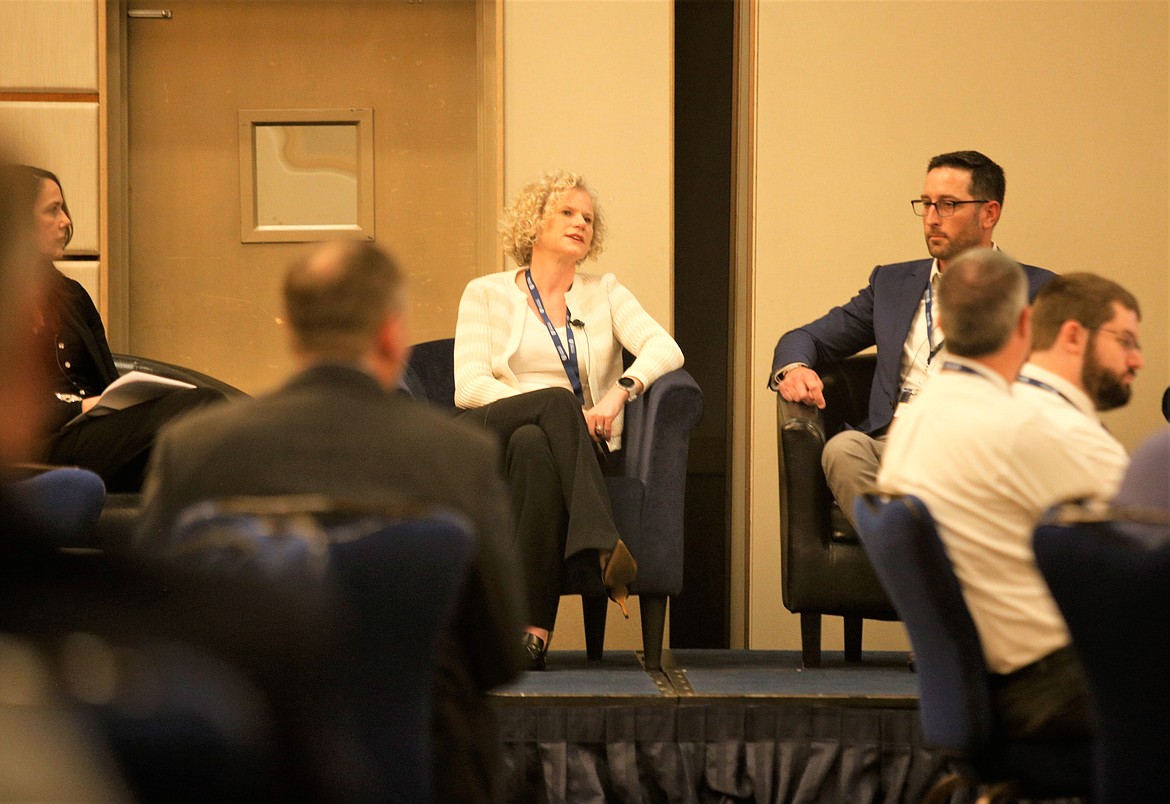 Moderator Kelly Maloney, left, Kelly Hennig and Ben Martin share the stage at the the  I-90 Aerospace Corridor Conference & Expo at The Coeur d'Alene Resort on Tuesday.
