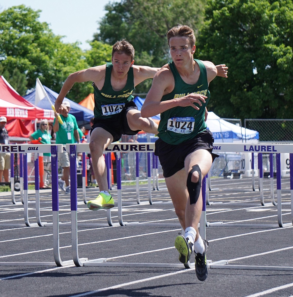 Brothers Bowdrie (left) and Carson Krack compete side-by-side during the men’s 110 meter hurdle finals on Saturday. Carson earned the bragging rights on this occasion recording a personal best time of 15.90 and sixth position on the podium. (Matt Weller photo)