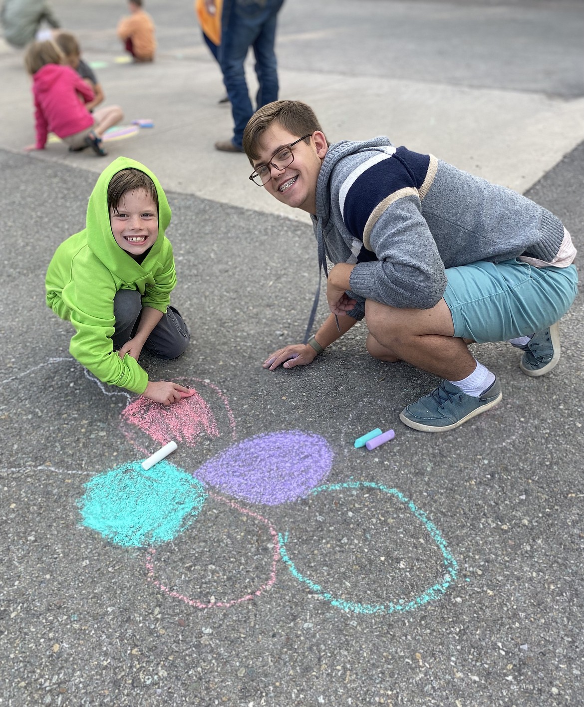 Flathead High School graduate Jacob Fort spends time with his first-grade Learn and Serve buddy Wesley Achziger. Learn and Serve was one of several mentor/service activities Fort was involved in during his high school career. (Photo provided by Flathead High School)