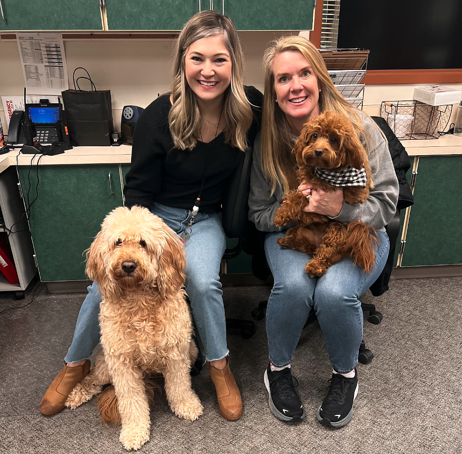 Desi Bahr, left, and Christine Barber, both of Atlas Elementary School, are seen recently with their trained facility dogs, goldendoodle Charlie and miniature goldendoodle Lulu. They are part of the expanding facility dog program in the Coeur d'Alene School District.