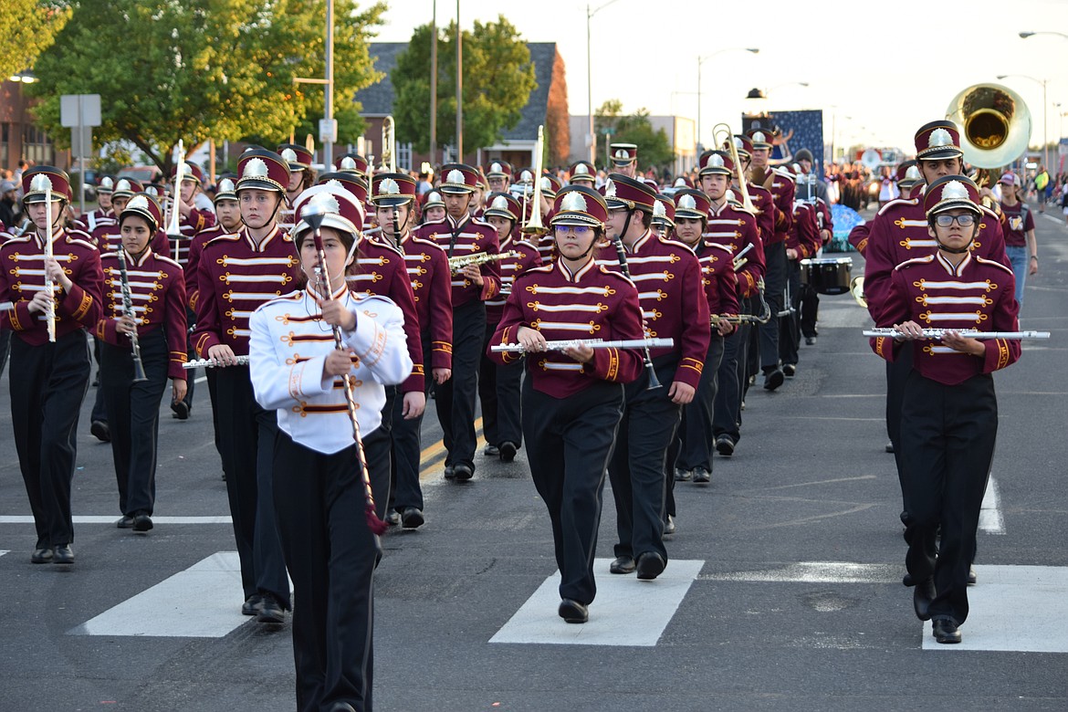 Members of the Moses Lake High School marching band parade down Third Avenue during the annual Grand Moonlight Parade on Saturday night.