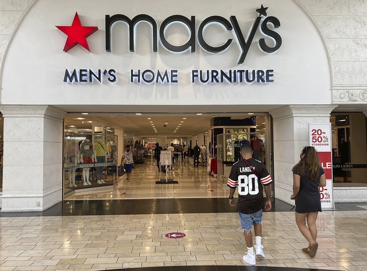 FILE - Shoppers walk into a Macy's department store Monday, Feb. 22, 2021, at Miami International Mall in Doral, Fla. Macy's reports their earnings on Thursday, June 1, 2023. (AP Photo/Wilfredo Lee)