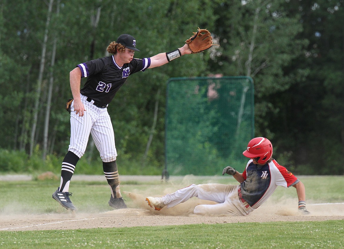 Soren Caprio slides safely into third base.