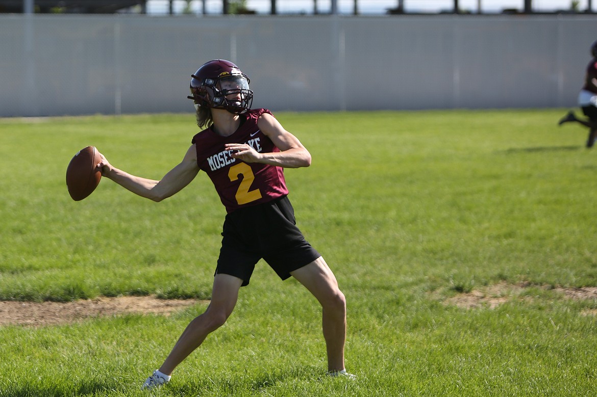 Moses Lake freshman Brady Jay drops back to pass during a spring practice on Tuesday.