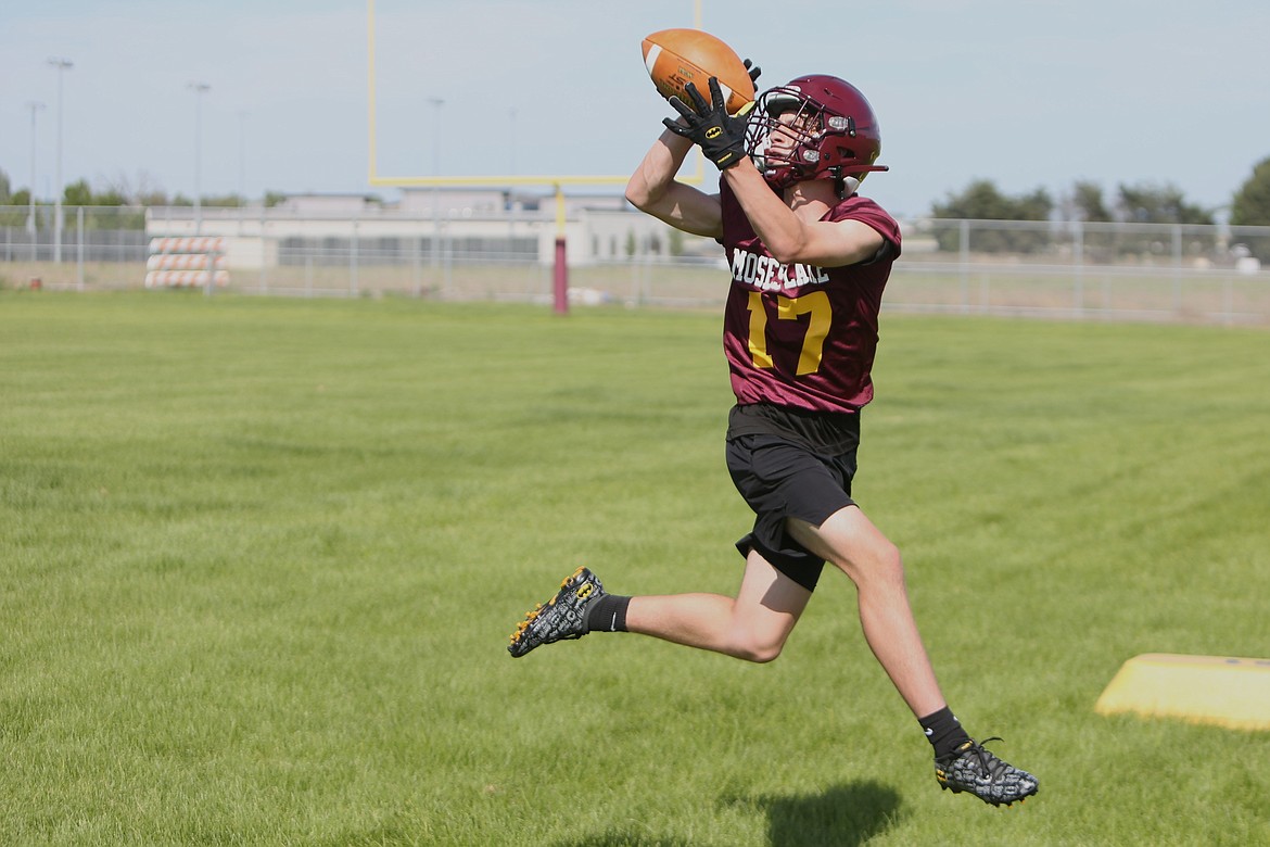 Moses Lake’s Jordan Henry catches a pass during a spring practice on Tuesday.