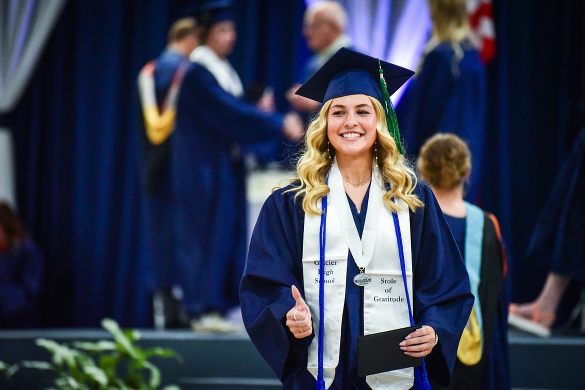 Graduate Isabella Marie AuClaire gives a thumbs up after receiving her diploma during Glacier High School's commencement ceremony on Saturday, June 3. (Casey Kreider/Daily Inter Lake)