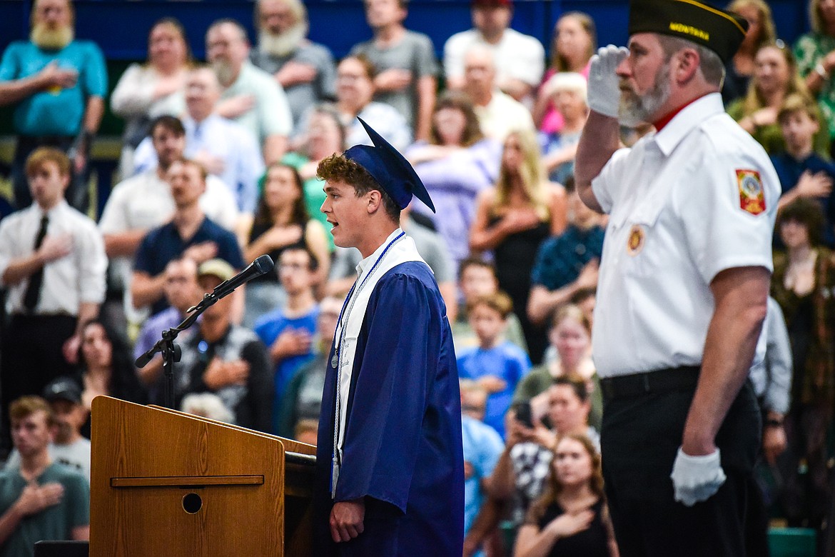 Kaid Buls, a Magna Cum Laude graduate with a Fine Arts Distinction in Music, sings the national anthem during the color guard presentation by VFW Post 2252 at Glacier High School's commencement ceremony on Saturday, June 3. (Casey Kreider/Daily Inter Lake)
