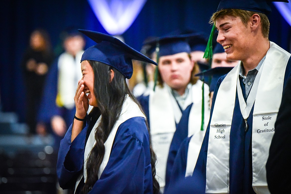 Graduates smile and laugh while filing into the gymnasium during Glacier High School's Class of 2023 commencement ceremony on Saturday, June 3. (Casey Kreider/Daily Inter Lake)