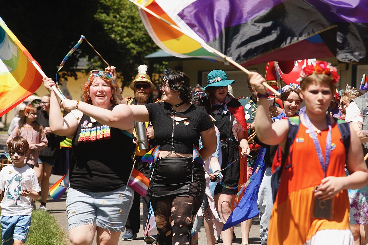 Michael McOmber and Dimitri Evans joined the Pride parade that wound through City Park.