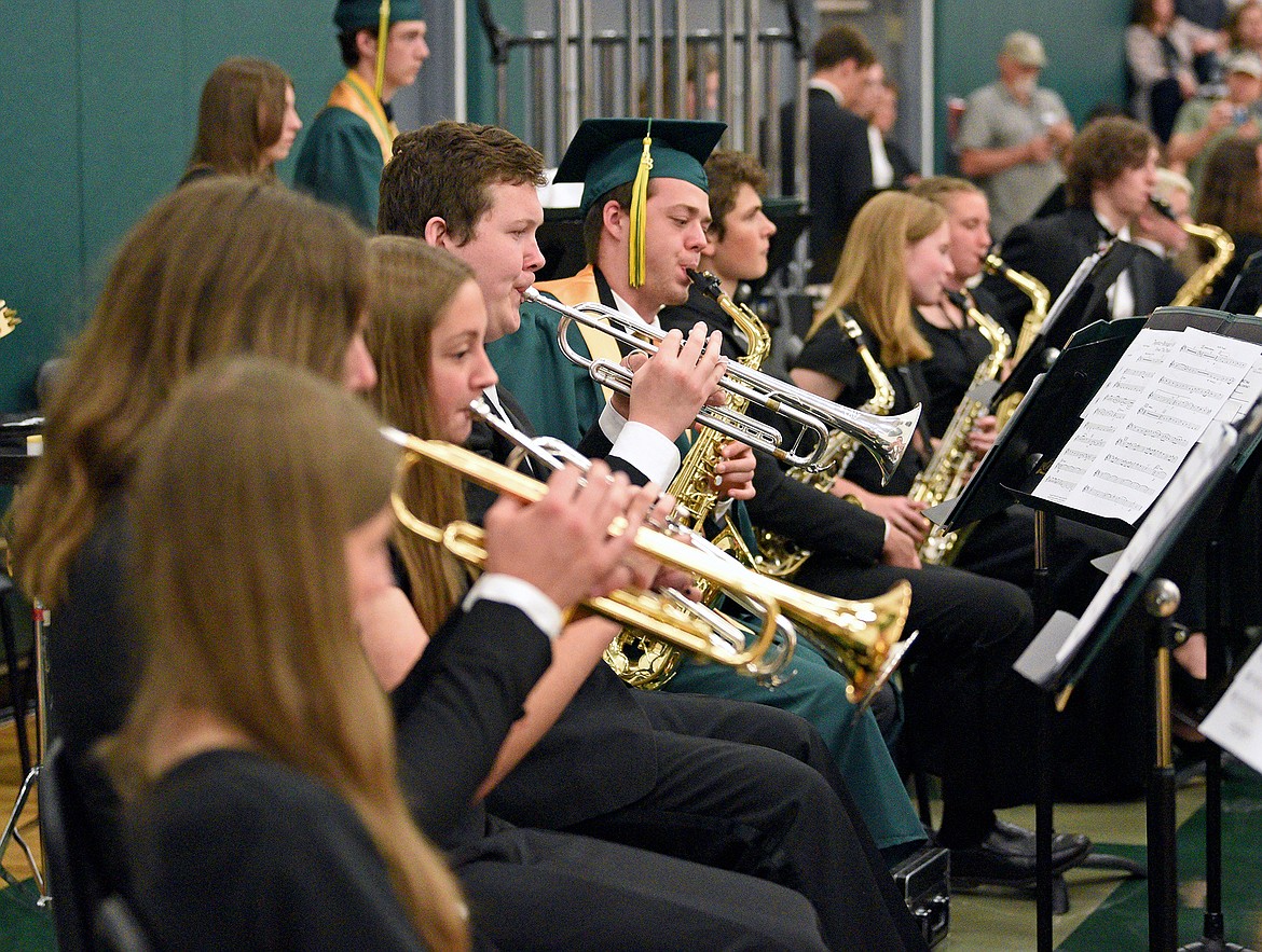 The Whitefish High School combined band and orchestra perform at the Commencement Ceremony in the high school gym on Saturday. (Whitney England/Whitefish Pilot)