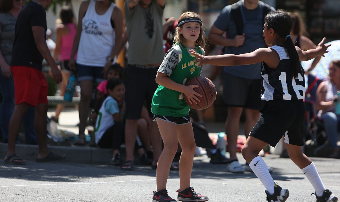 The Dru Gimlin 3-on-3 tournament took to the streets of downtown Quincy on Saturday, hosting 100 teams on 12 outdoor courts.