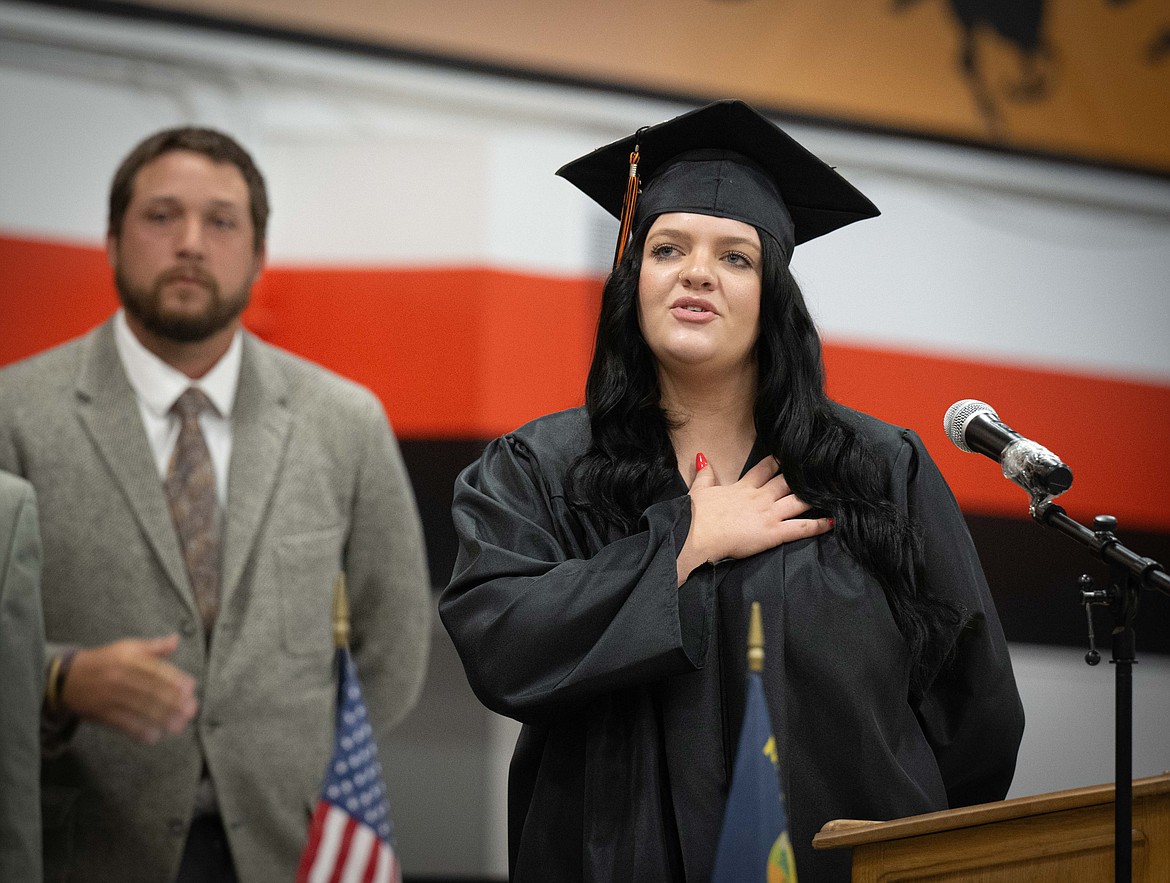 Plains graduate Faith McGonagle leads the Pledge of Allegiance at the commencement ceremony. (Tracy Scott/Valley Press)