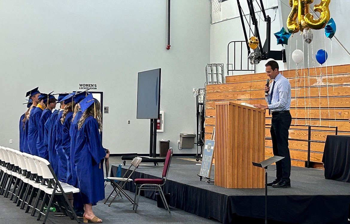 Moses Lake Christian Academy students stand and listen to speakers during their graduation ceremony on Saturday. Among this year’s class at MLCA are aspiring actors, nurses and those eying many other professions.