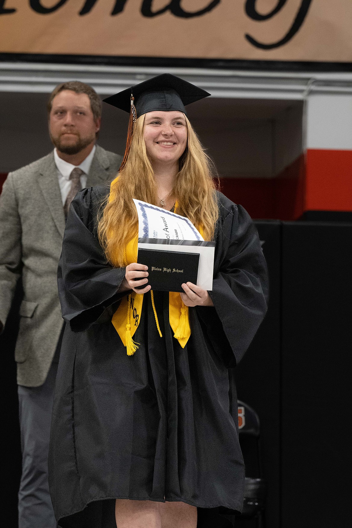 Plains graduate Izibelle Crabb shows off her diploma. (Tracy Scott/Valley Press)