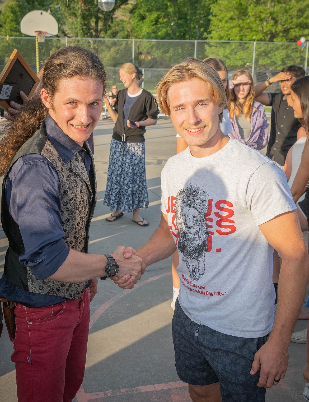 Jubal Ryan congratulates this year's limbo dance winner Justin Yoder. (Tracy Scott/Valley Press)