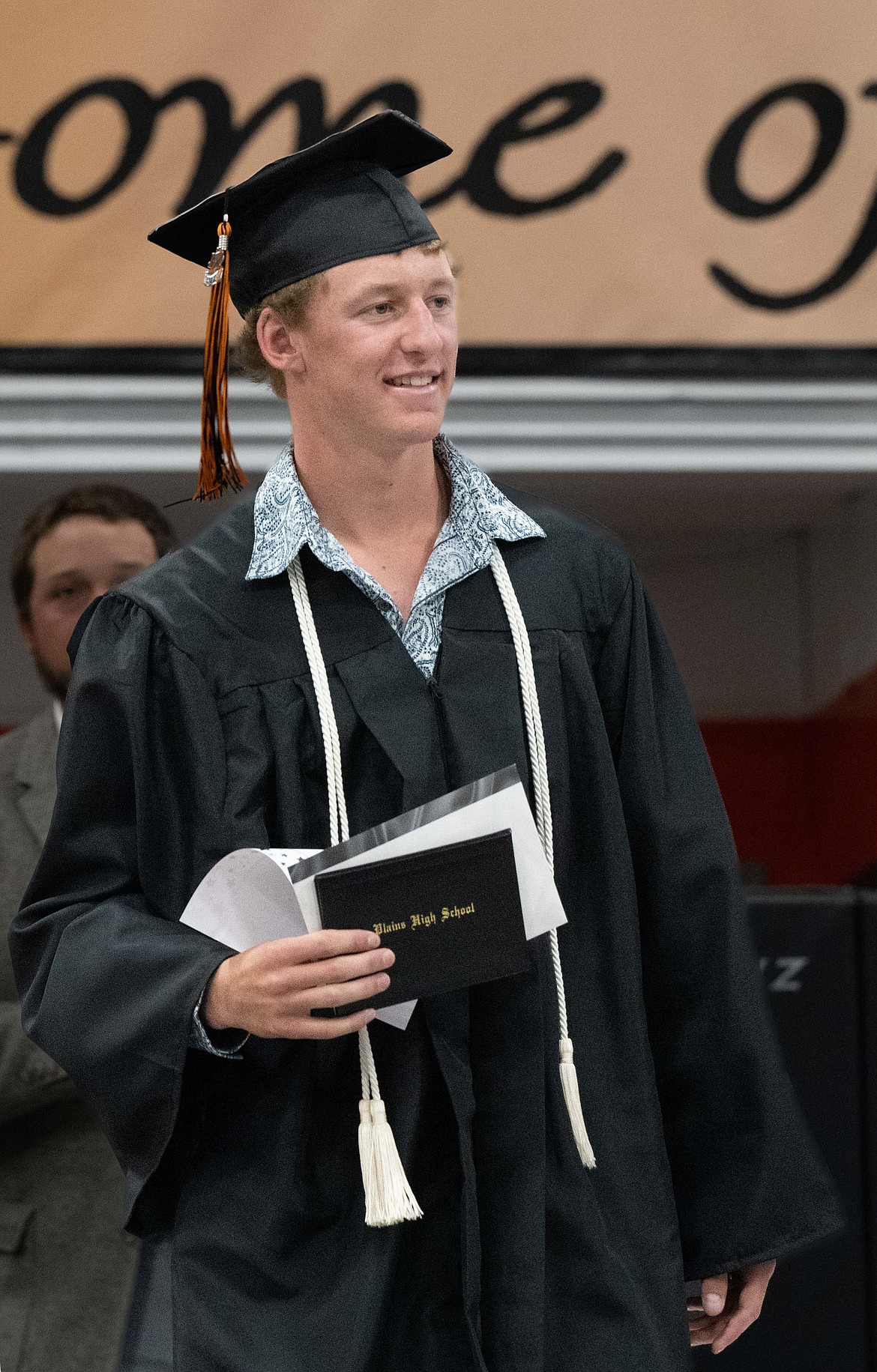 Plains graduate Mason Elliott shows off his diploma. (Tracy Scott/Valley Press)