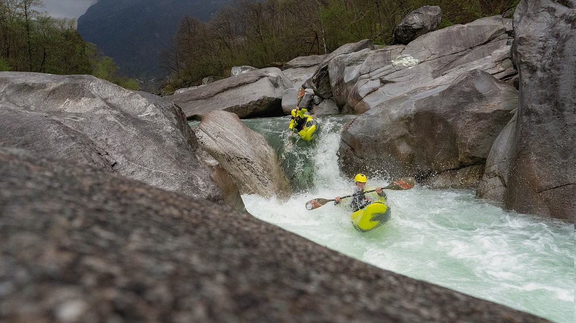 Max and another student-athlete kayak downriver while in Italy.