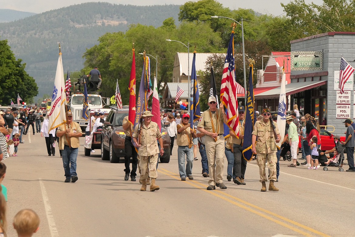 The VFW Honor Guard leads the event-opening parade through town during Saturday's Plains Day celebration.  (Chuck Bandel/VP-MI)