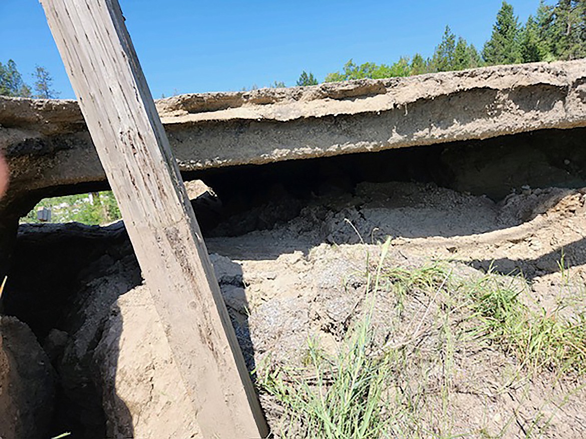 A pipe collapsed beneath Dufort Road in the 5700 block of the roadway left up to a two-foot gap between the asphalt layer and the surviving road bed.