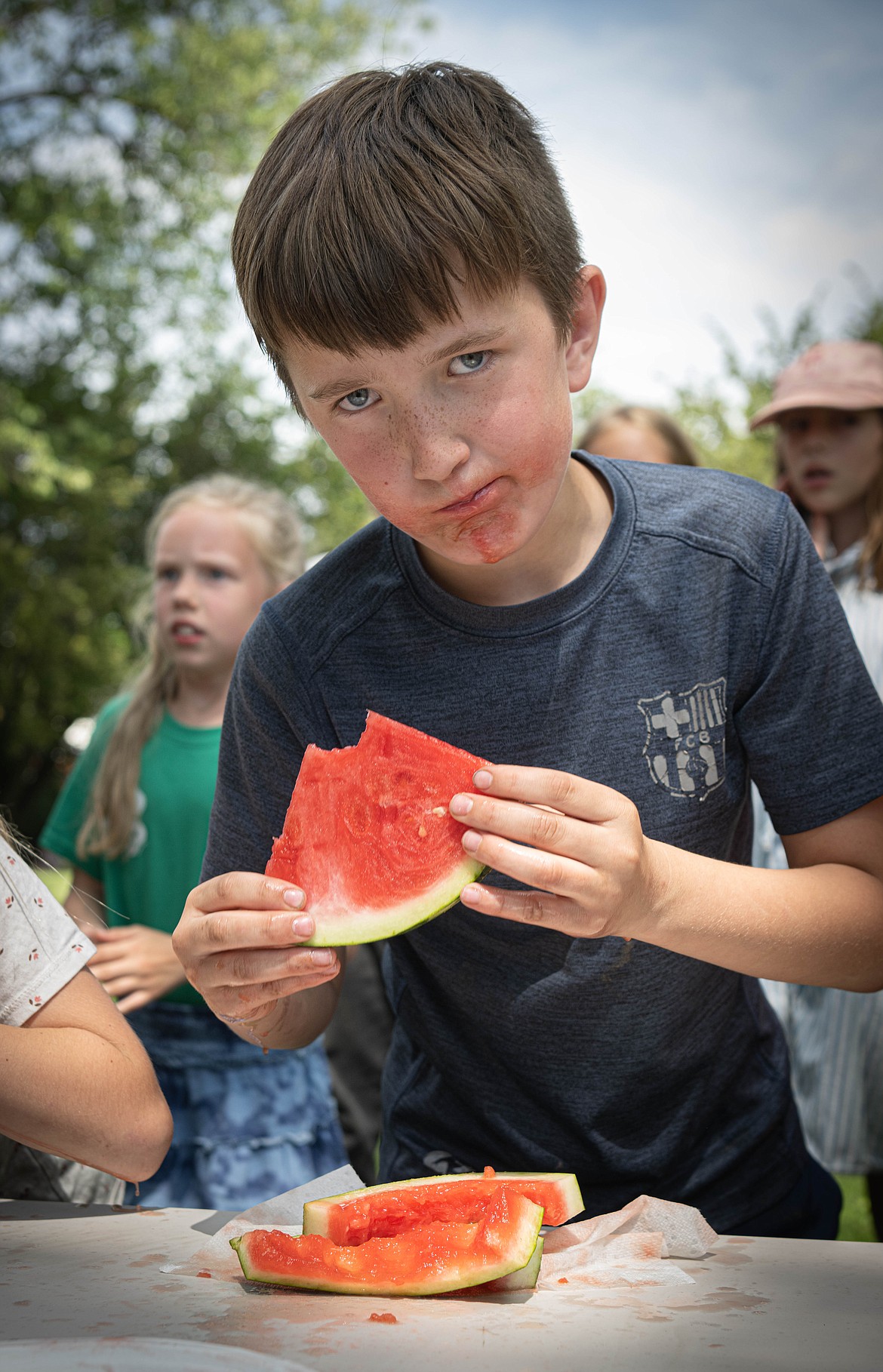 Spencer Lakko during the watermelon contest. (Tracy Scott/Valley Press)