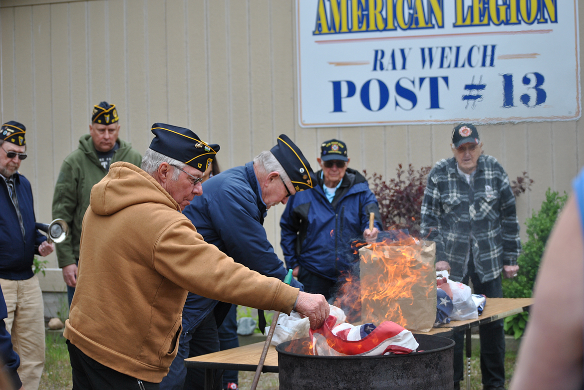 St. Regis American Legion Post 13 members conduct a flag disposal ceremony. (Photo provided)