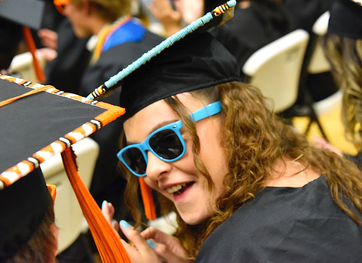 Ronan High School graduates visit about diplomas and graduation parties at friends' houses. (Berl Tiskus/Leader)