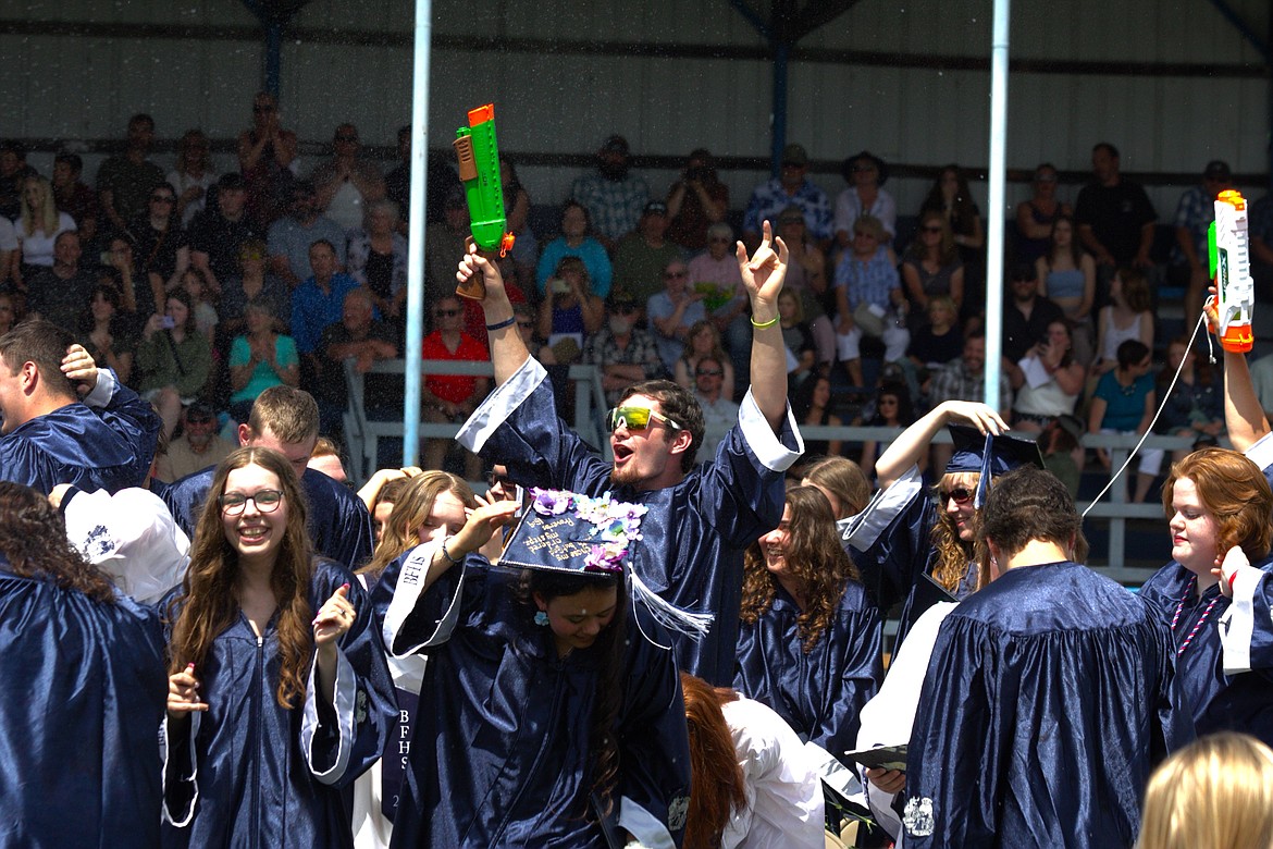 Graduates celebrate.