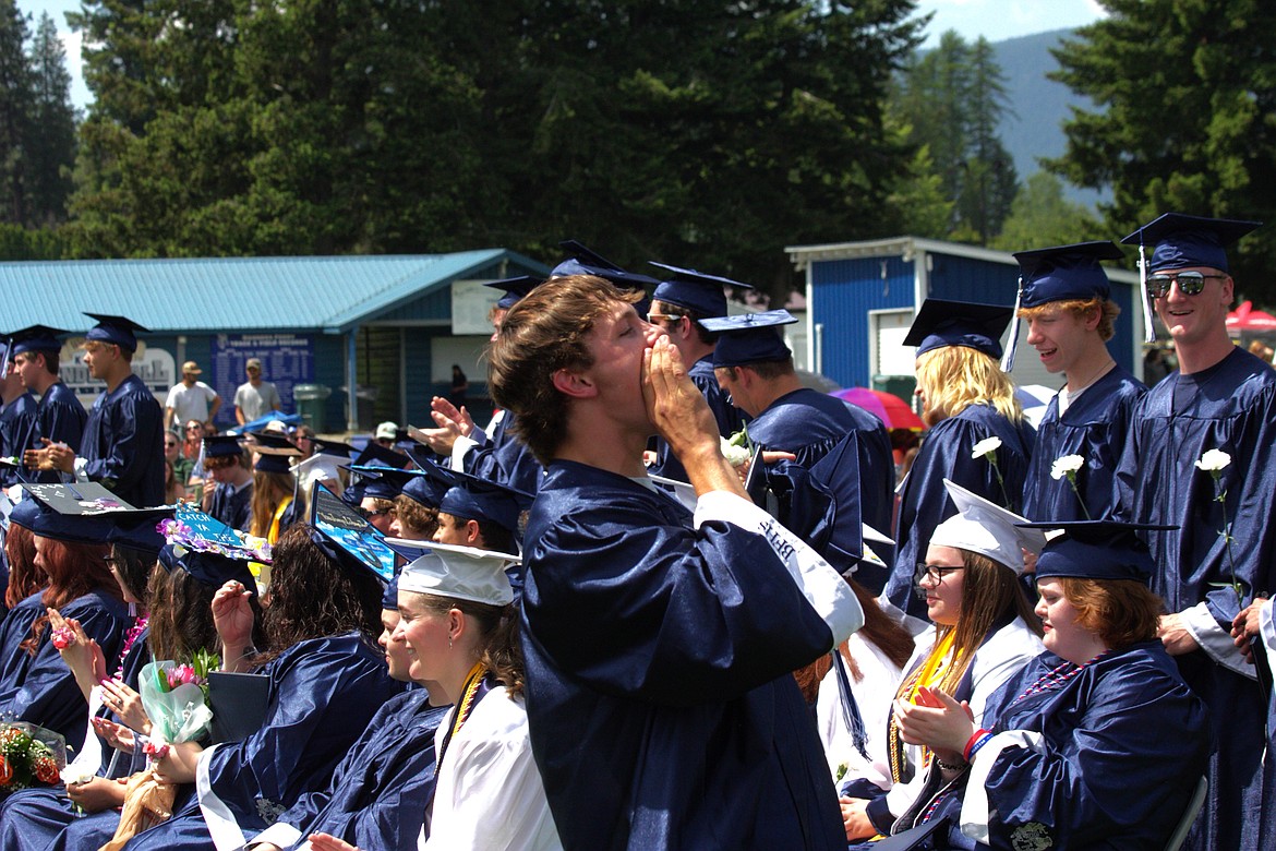 Charles Henslee gives celebratory yell after receiving his diploma.